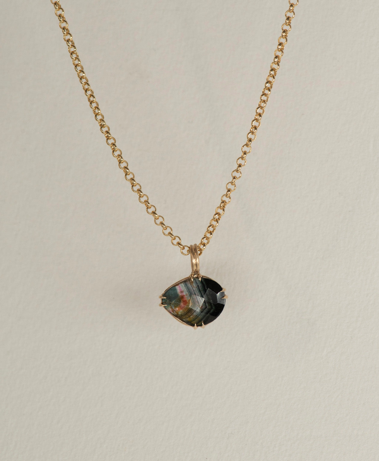 One of a Kind Charm 498 with a rose cut black Tourmaline on a belcher chain.