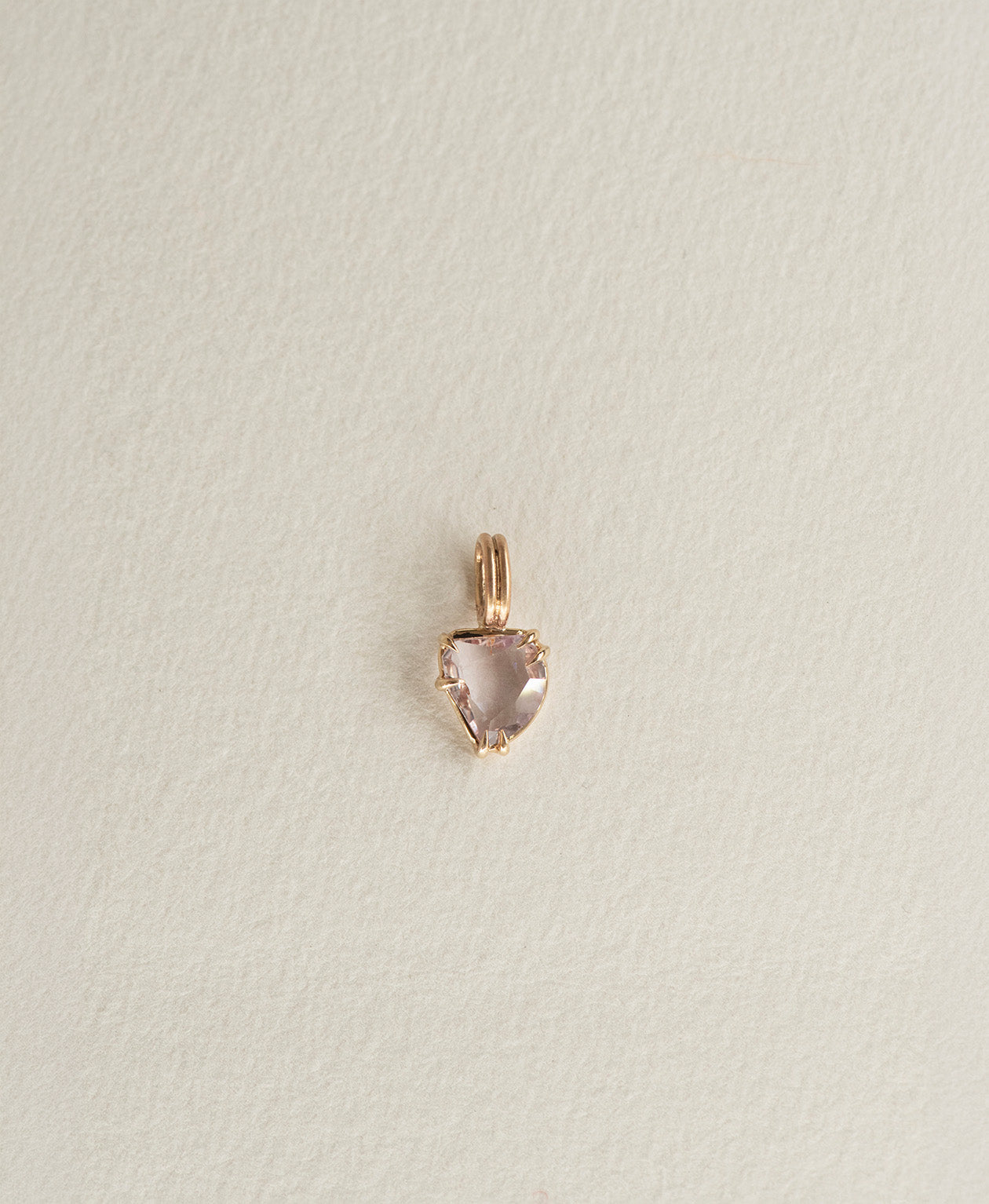 One of a Kind Charm 499 in 9k Yellow Gold featuring a light pink rose cut Sapphire with a claw setting.