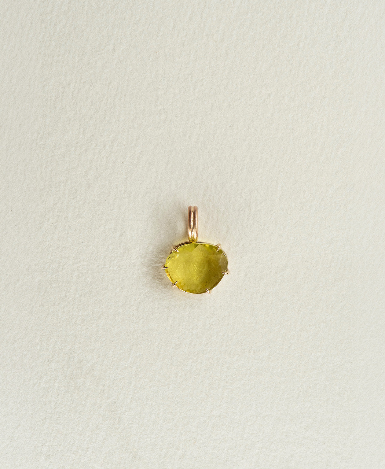 One of a Kind Charm 503 in 9k Yellow Gold featuring a rose cut green Tourmaline with a claw setting.
