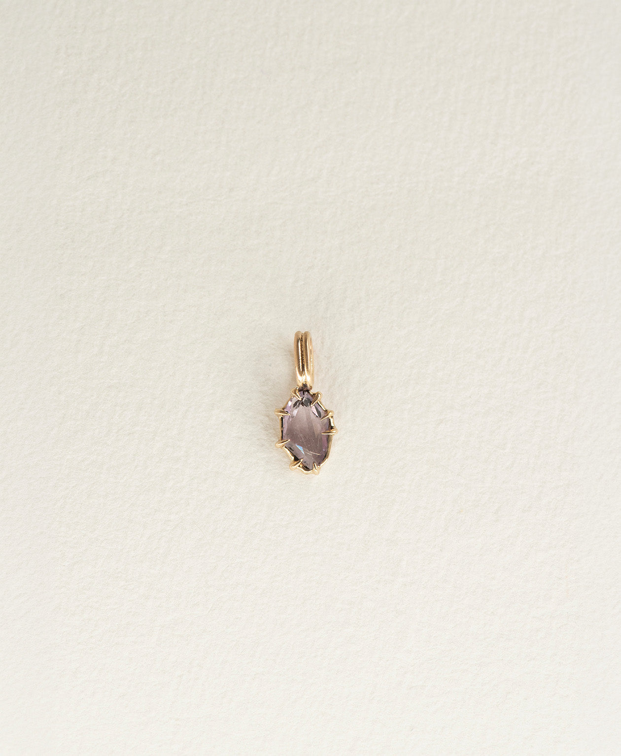 One of a Kind Charm 510 in 9k Yellow Gold featuring a purple portrait cut Sapphire with a claw setting.