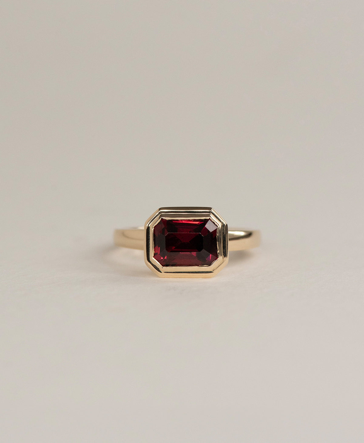 Delphine Engagement Ring - 9k Yellow Gold, Emerald Cut Garnet 2.87 carat