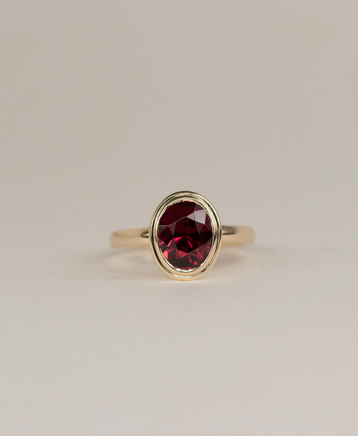 Delphine Engagement Ring - 9k Yellow Gold, Oval Cut Garnet 3.0 carat