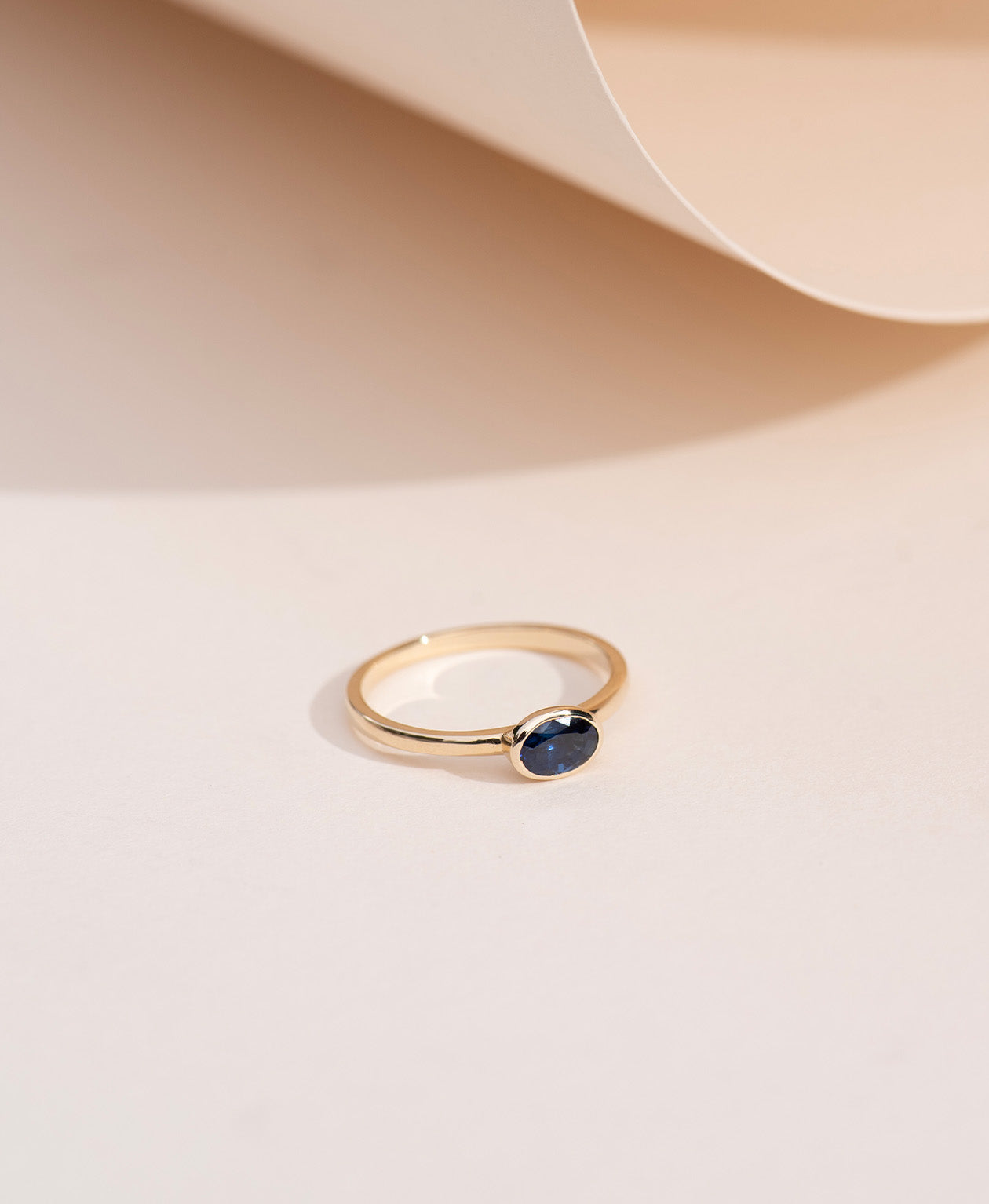 Mon Petit Stacker Ring - 9k Yellow Gold, Oval Cut Blue Sapphire