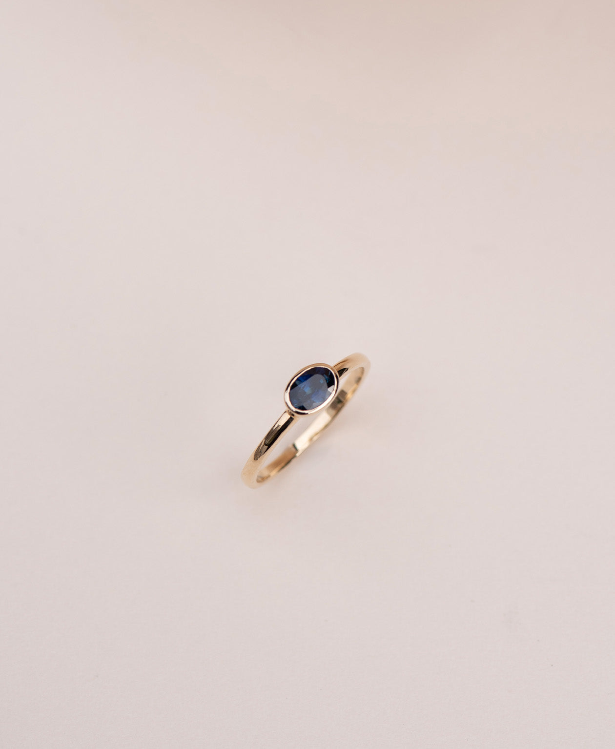 Mon Petit Stacker Ring - 9k Yellow Gold, Oval Cut Blue Sapphire