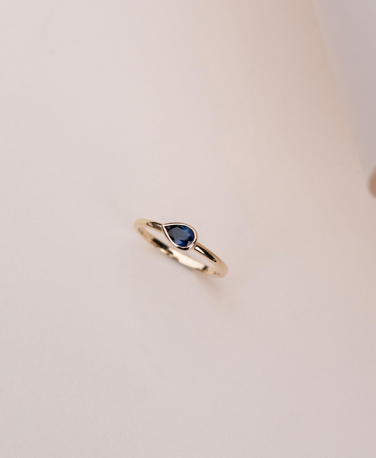 Mon Petit Stacker Ring - 9k Yellow Gold, Pear Cut Blue Sapphire