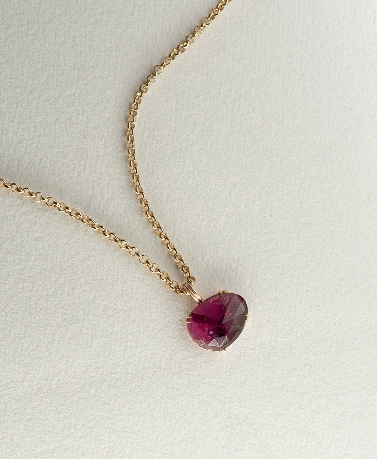 One of a Kind Charm 492 with a rose cut pink tourmaline on a belcher chain.