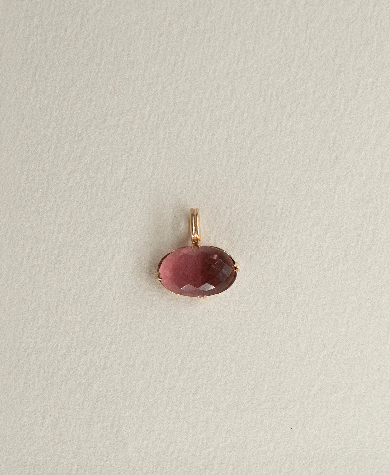 One of a Kind Charm 493 in 9k Yellow Gold featuring a checkerboard cut fuchsia pink tourmaline, with a double claw setting.