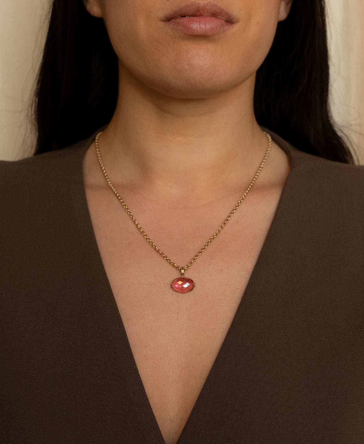 One of a Kind Charm 493 with a checkerboard cut fuchsia pink tourmaline worn by a model on a belcher chain. 