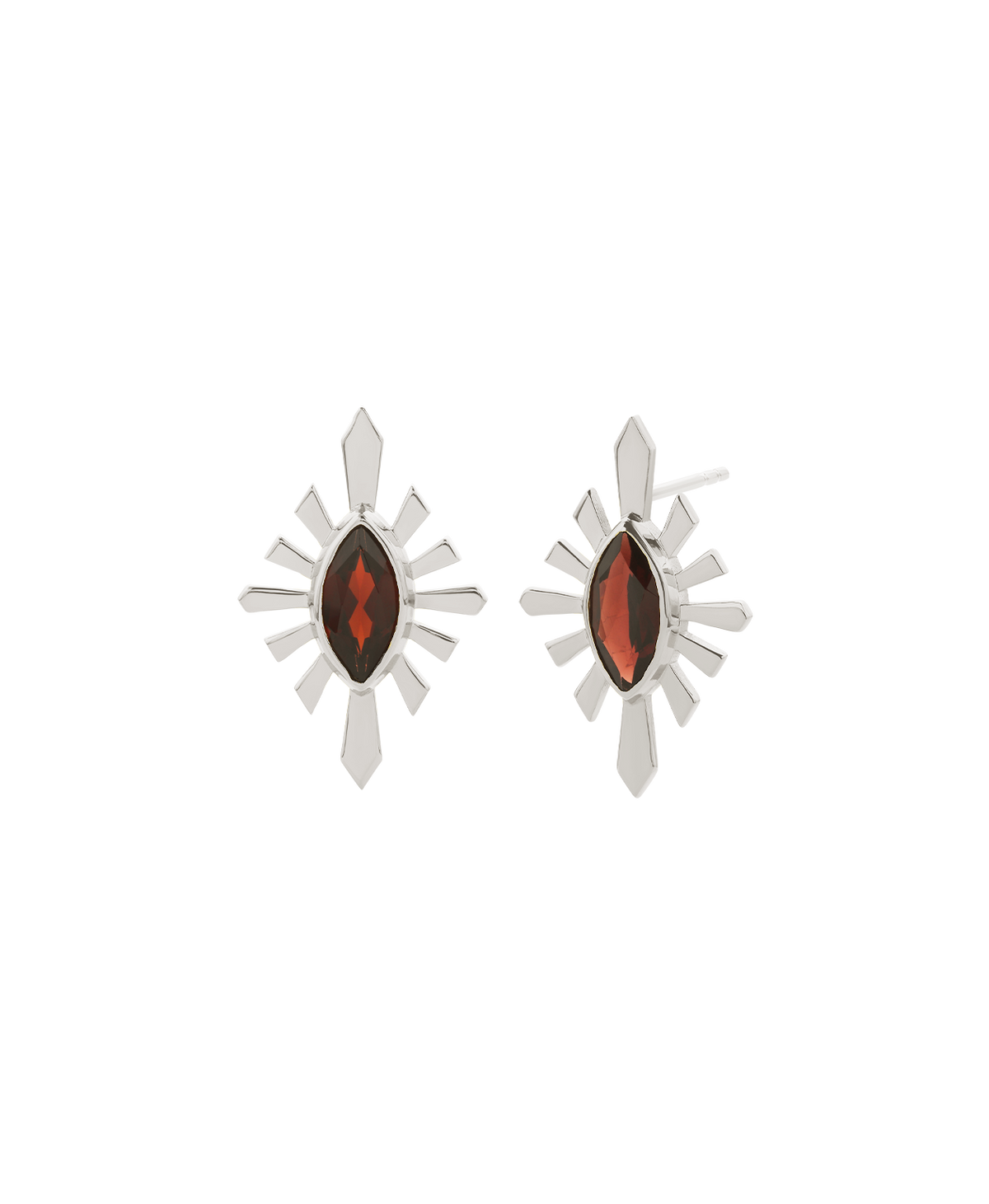 A clear cut of the Sister Studs, featuring a marquise cut garnet in a silver linear sunburst frame. 