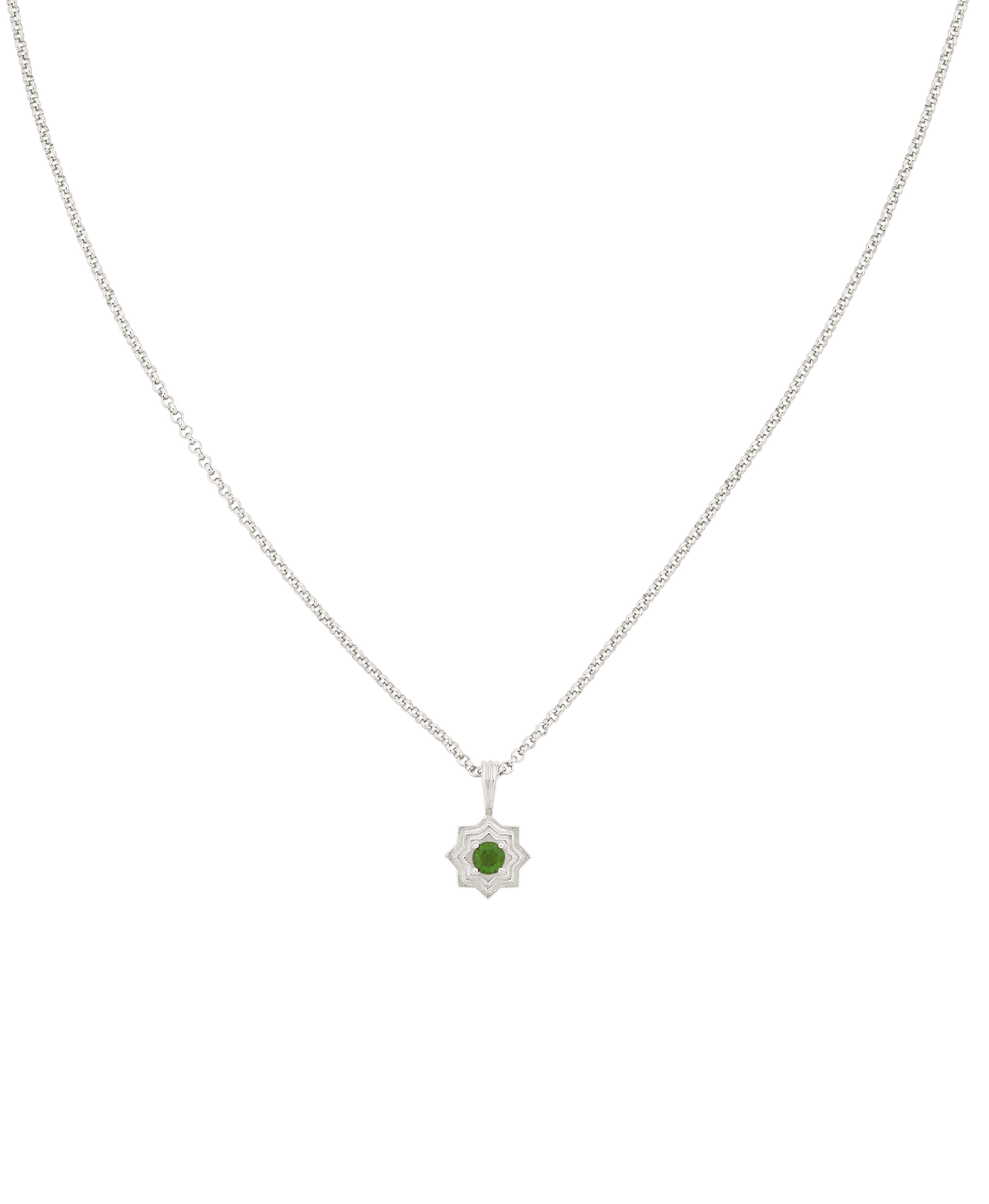 A clearcut of the Sitara Necklace, a silver star-like pendant with a central green stone. 